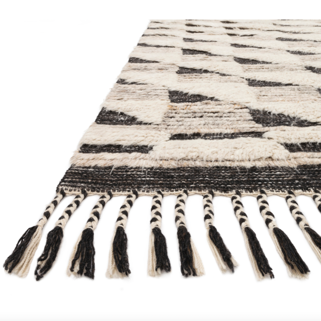 A nod to timeless Moroccan style, the Khalid Collection is hand-knotted in India by skilled artisans. The soft pile features 100% natural, undyed wool, lending slight variations in tones that make each piece it's own. Plus, each rug is finished with a thoughtfully designed fringe.  Hand Knotted 100% Wool KF-02 Natural/Black