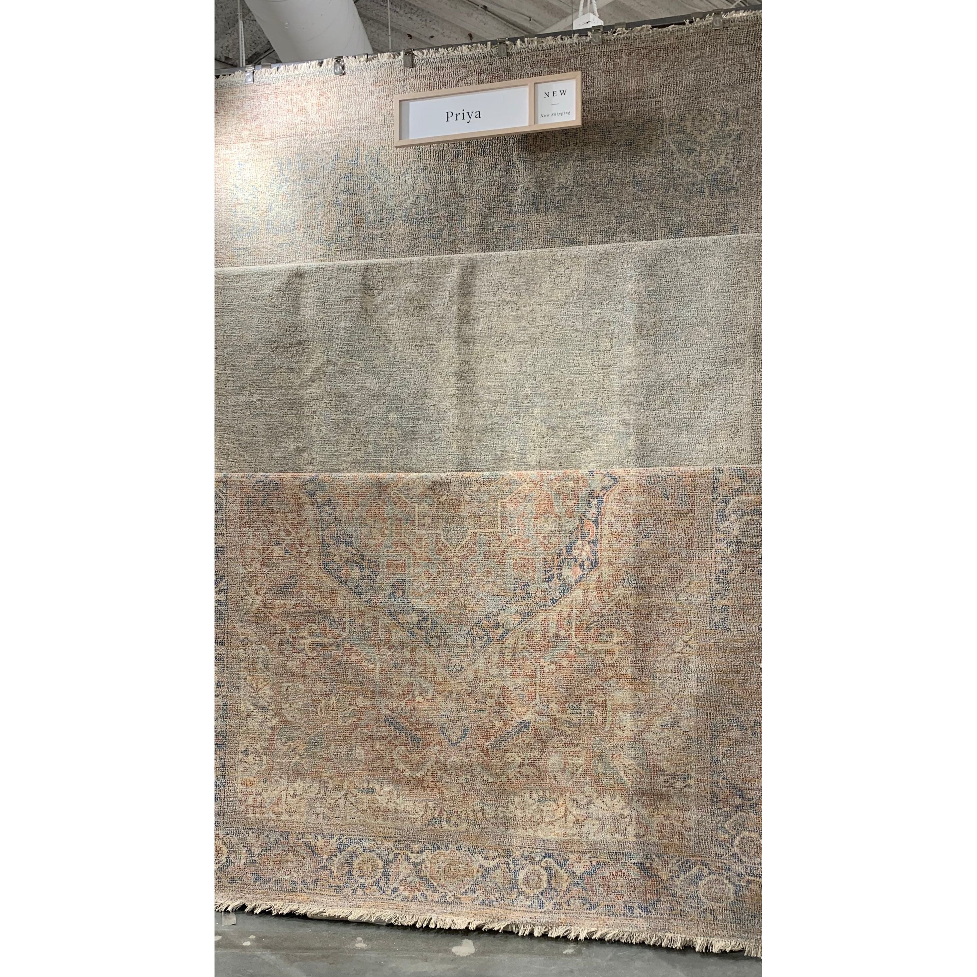 Hand-woven by skilled artisans, the Priya Bone / Bluestone Area Rug from Loloi offers beautiful tonal designs accentuated by a carefully curated color palette. Delicate yet strong, Priya is an instant classic made for today's home.  Hand Woven 51% Cotton | 29% Polyester | 12% Viscose | 8% Wool PRY-08 Bone/Bluestone Colors: Blue, Orange, Beige