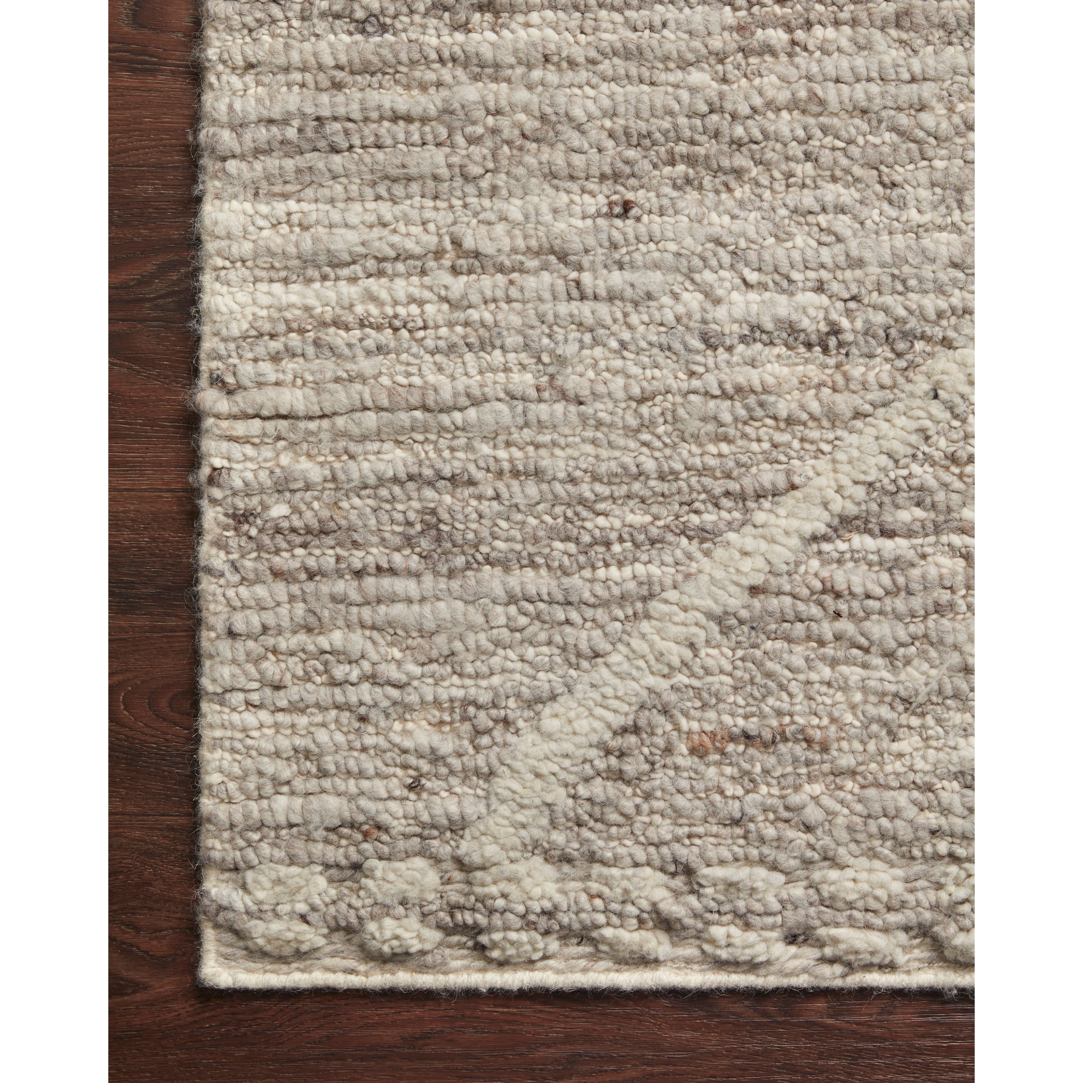 Hand-woven of 100% wool in India, the Loloi Rayan Ash Area Rug, or RAY-05, sets the tone for a calming atmosphere. Each design is crafted of textural highs and lows paired with neutral tones to create and engaging understatement. The perfect rug for your bedroom, office, or other medium traffic area. 