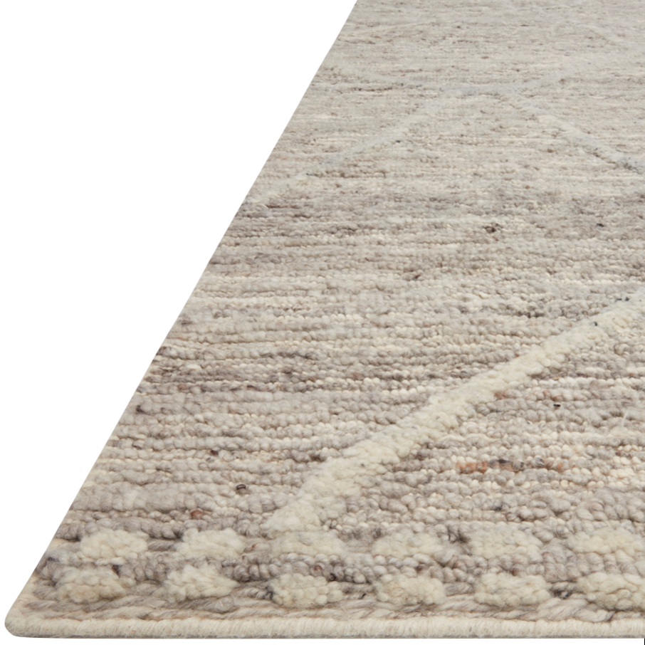 Hand-woven of 100% wool in India, the Loloi Rayan Ash Area Rug, or RAY-05, sets the tone for a calming atmosphere. Each design is crafted of textural highs and lows paired with neutral tones to create and engaging understatement. The perfect rug for your bedroom, office, or other medium traffic area. 