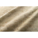 Hand knotted of 100% wool by skilled artisans, the Loloi Vincent Pebble / Pebble Area Rug, or VC-06, offers the look of a well-worn antique rug in a modern day color palette. Each exquisite piece undergoes a weeks-long antique washing process which fades the pattern and color beautifully. 