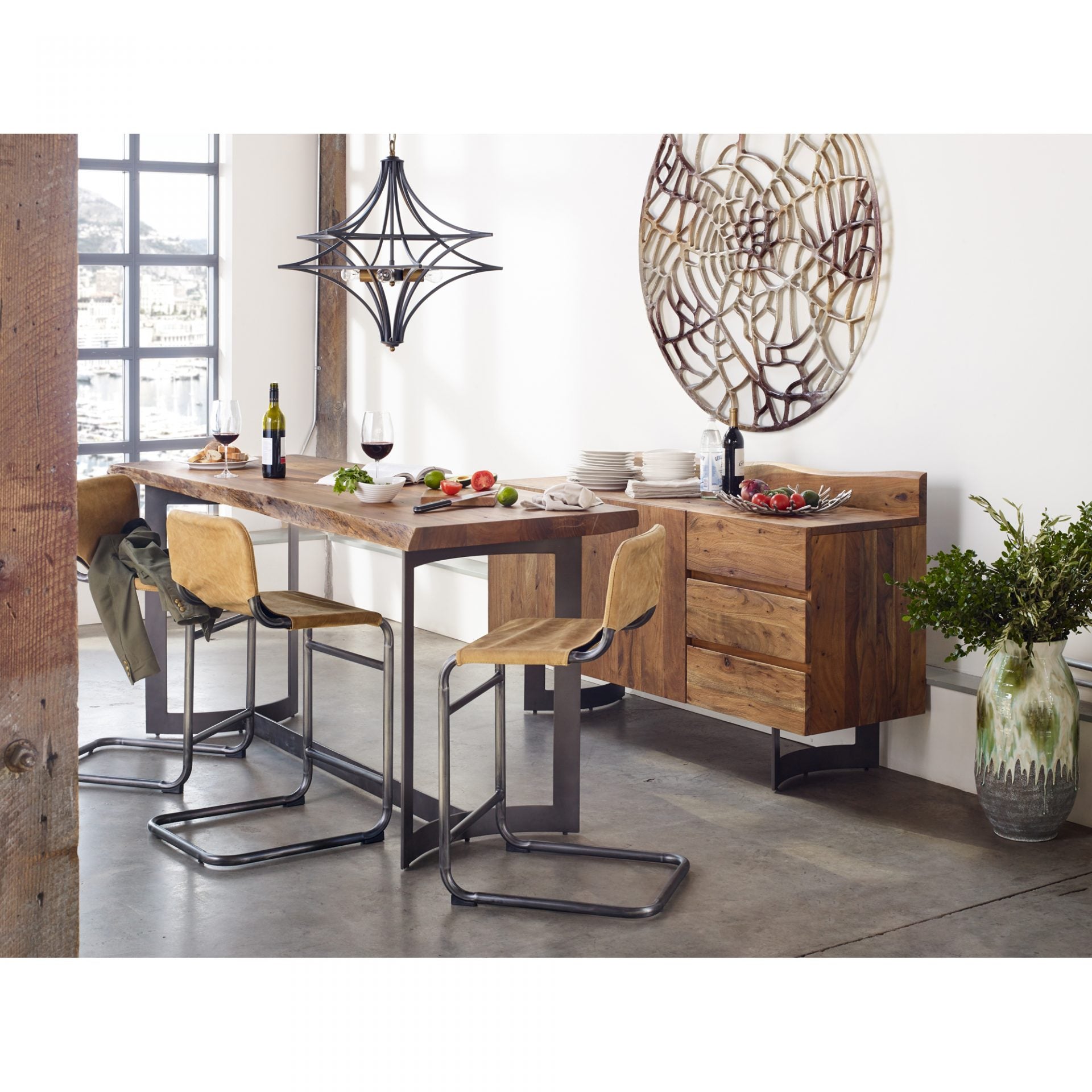 This Baker Counter Stool - Sunbaked Tan Leather has an ultra-supple tan leather seat, supported by a thick black iron frame. Sure to complete the look for any kitchen, island, or other area!   Size: 19"W x 21"D x 35"H