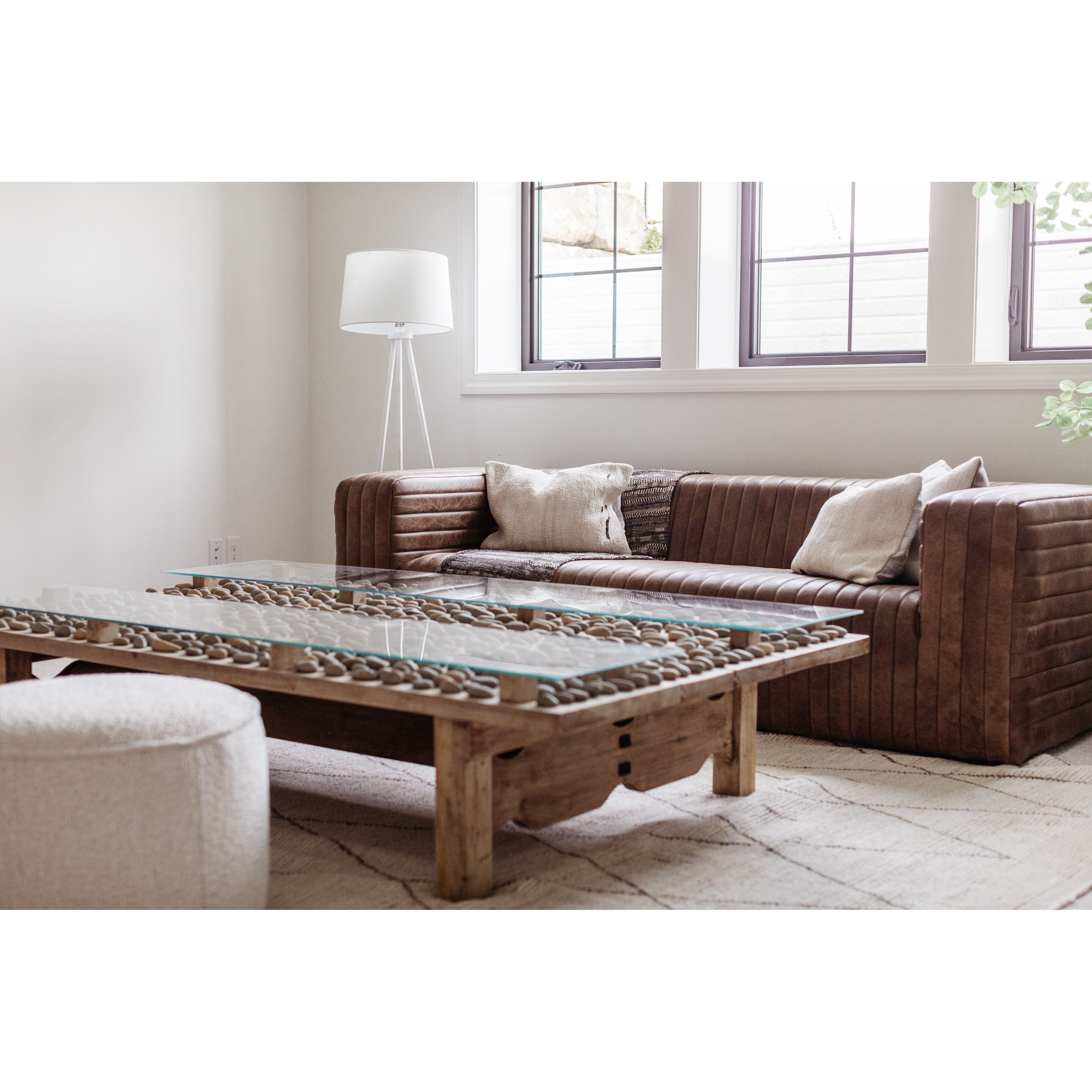 Wrapped in premium, channel-stitched top-grain leather and with spacious seating for 3, this Castle Sofa Cappuccino is a dapper piece to add to any living room or lounge area. With extra deep cushion spring support, this is perfect for unwinding after a long day in.   Dimensions: 94.5"W x 40.5"D x 27.5"H  Seat Height: 17" Back Height: 10" Arm Height: 10" 