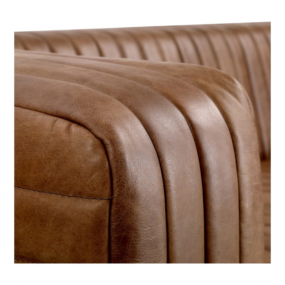 Wrapped in premium, channel-stitched top-grain leather and with spacious seating for 3, this Castle Sofa Cappuccino is a dapper piece to add to any living room or lounge area. With extra deep cushion spring support, this is perfect for unwinding after a long day in.   Dimensions: 94.5"W x 40.5"D x 27.5"H  Seat Height: 17" Back Height: 10" Arm Height: 10" 