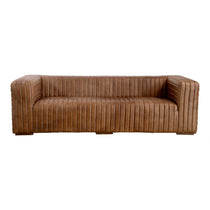 Wrapped in premium, channel-stitched top-grain leather and with spacious seating for 3, this Castle Sofa Cappuccino is a dapper piece to add to any living room or lounge area. With extra deep cushion spring support, this is perfect for unwinding after a long day in.   Dimensions: 94.5"W x 40.5"D x 27.5"H  Seat Height: 17" Back Height: 10" Arm Height: 10" 