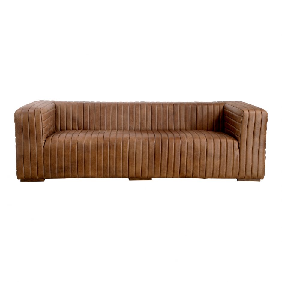 Wrapped in premium, channel-stitched top-grain leather and with spacious seating for 3, this Castle Sofa Cappuccino is a dapper piece to add to any living room or lounge area. With extra deep cushion spring support, this is perfect for unwinding after a long day in.   Dimensions: 94.5"W x 40.5"D x 27.5"H  Seat Height: 17" Back Height: 10" Arm Height: 10" 