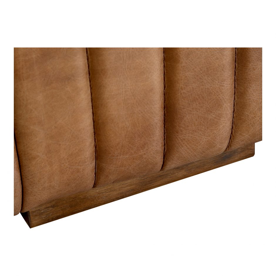 Wrapped in premium, channel-stitched top-grain leather and with spacious seating for 3, this Castle Sofa Cappuccino is a dapper piece to add to any living room or lounge area. With extra deep cushion spring support, this is perfect for unwinding after a long day in.   Dimensions: 94.5"W x 40.5"D x 27.5"H  Seat Height: 17" Back Height: 10" Arm Height: 10" 