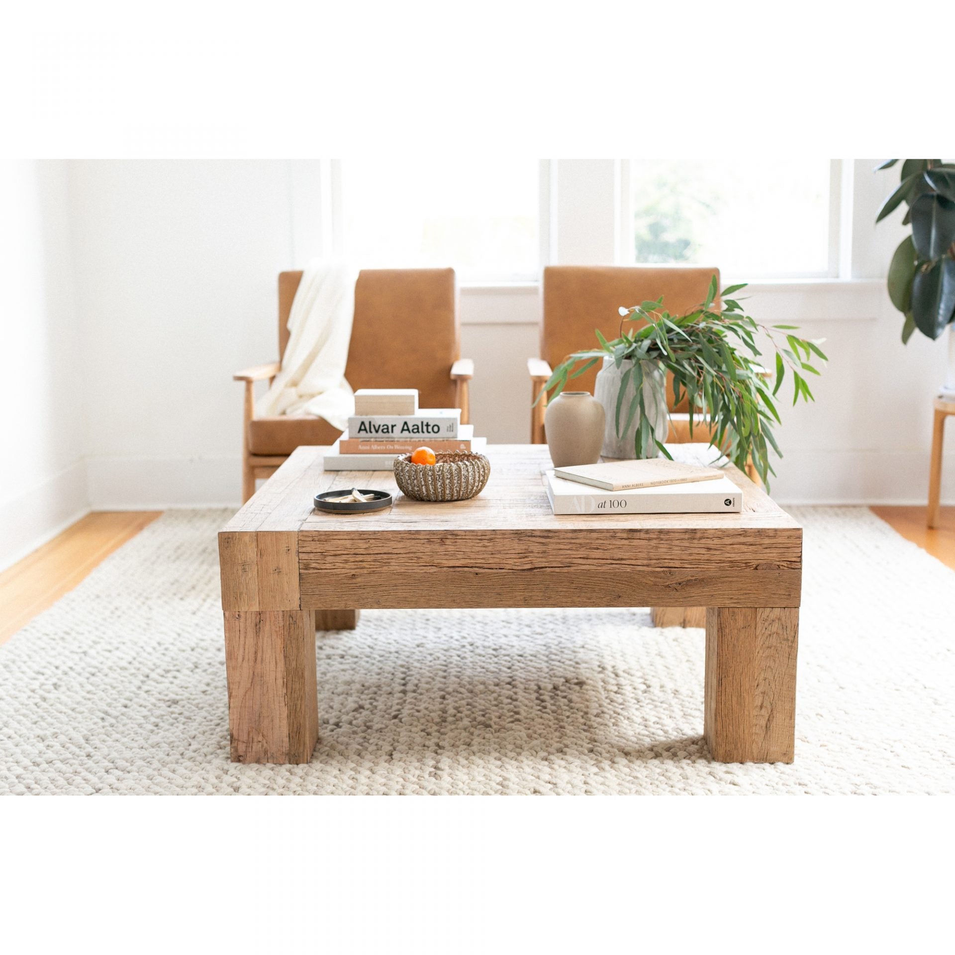 Formed from solid reclaimed oak, the Evander Coffee Table features wild grains and knots, producing a unique surface alongside its modern, blocked construction. We'd love to see this featured in your living room, lounge area, or others space!  Dimensions: 39.5"W x 39.5"D x 16.5"H  Materials:  Solid Reclaimed Oak Frame, Oak Veneer over Plywood