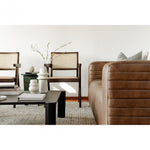 We love the unique legs found on this Post Coffee Table - Black Oak. Made from solid oak, this coffee table sits lower to the ground, inviting more communication on its sturdy dowel legs.  Dimensions: 36"W x 36"D x 13"H Materials:  Solid Oak