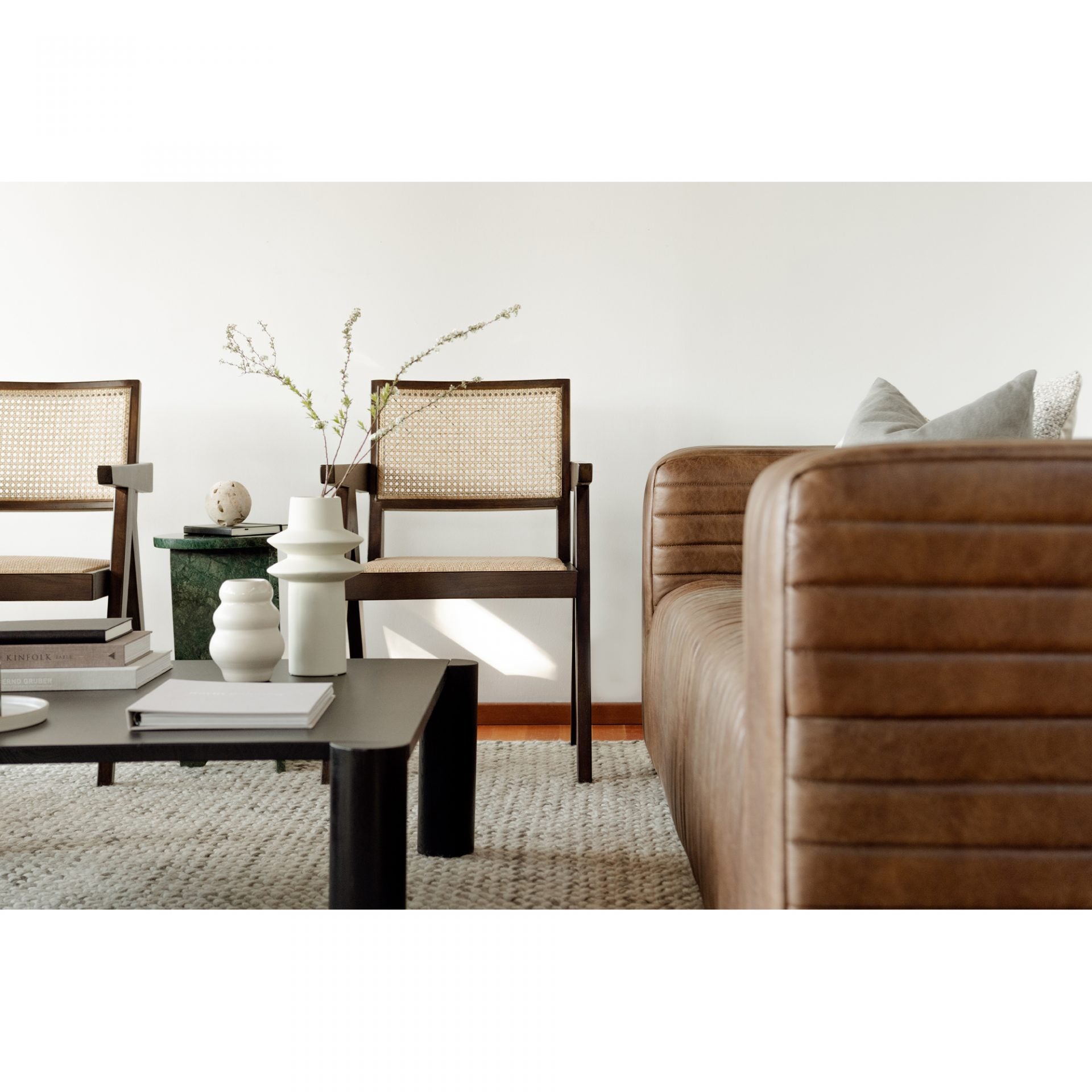 We love the unique legs found on this Post Coffee Table - Black Oak. Made from solid oak, this coffee table sits lower to the ground, inviting more communication on its sturdy dowel legs.  Dimensions: 36"W x 36"D x 13"H Materials:  Solid Oak