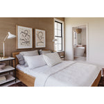The Round Off Bed showcases organic solid oak, with the beautiful pale tones of the grain matched to a simple, comforting design. The low build and soft molded corners are both kid and pet friendly -- a bright and light piece to bring to any bedroom.   King Dimensions: 81"W x 84"D x 30"H Queen Dimensions: 64"W x 84"D x 30"H  Materials: Solid oak and and oak veneer, MDF, plywood slats