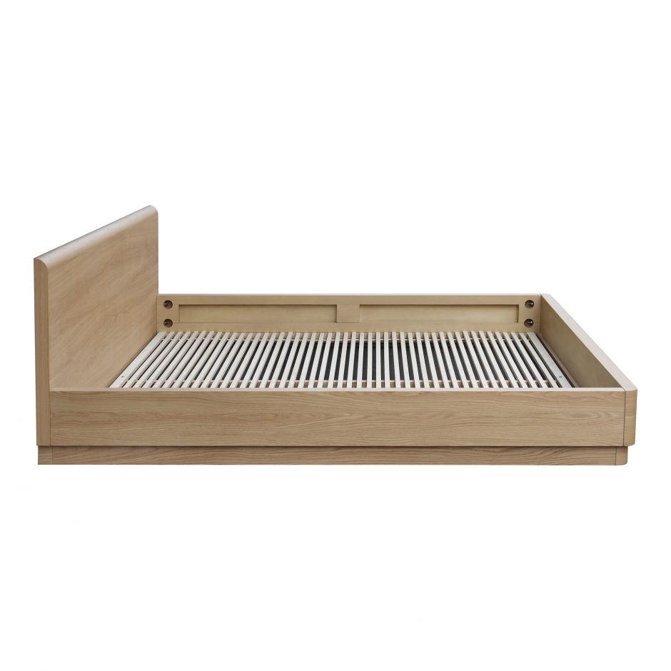 The Round Off Bed showcases organic solid oak, with the beautiful pale tones of the grain matched to a simple, comforting design. The low build and soft molded corners are both kid and pet friendly -- a bright and light piece to bring to any bedroom.   King Dimensions: 81"W x 84"D x 30"H Queen Dimensions: 64"W x 84"D x 30"H  Materials: Solid oak and and oak veneer, MDF, plywood slats