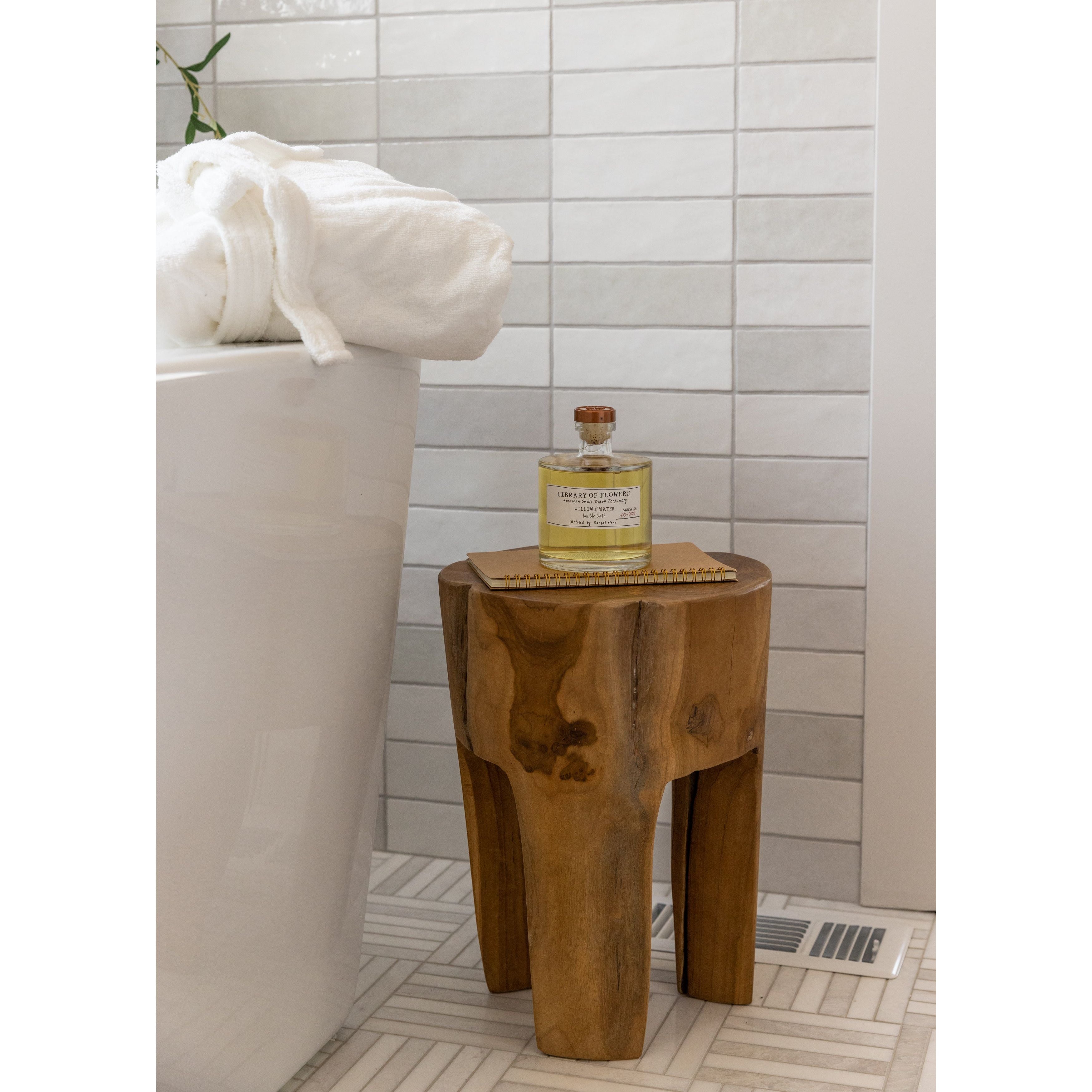 A bit of wabi sabi in our Amelia teak root side table -- perfect for indoors or outdoors. Amethyst Home provides interior design, new home construction design consulting, vintage area rugs, and lighting in the Seattle metro area.