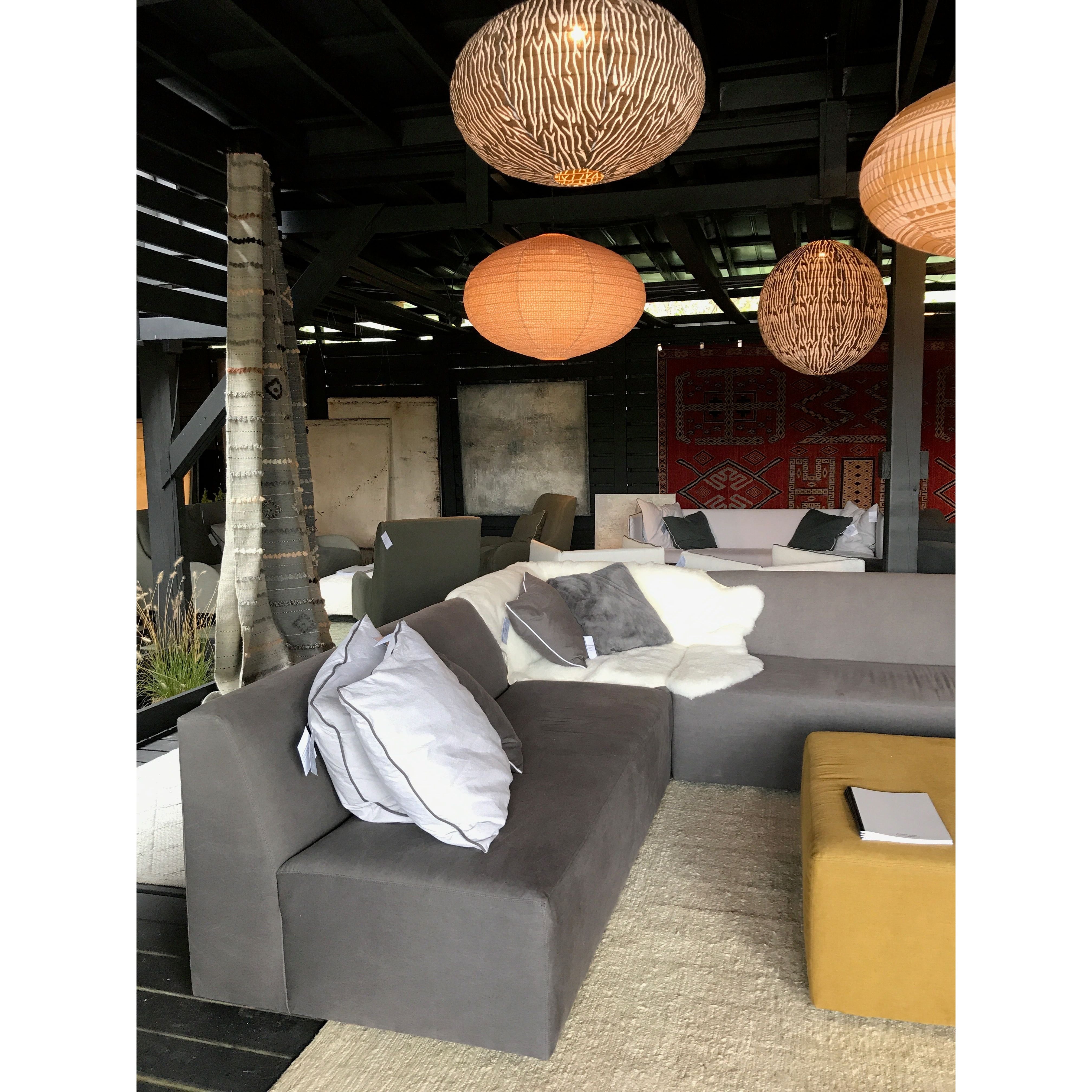 The Happy Section Family is a streamlined, chic modular sectional that will elevate the space of any home.  Crafted in Verellen's North Carolina atelier, it features: Happy Corner Unit (x2) | Happy Armless Chair | Happy Ottoman