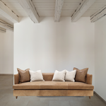 Verellen's Marilyn Sofa Family is bench-crafted in their North Carolina atelier, and features:  foam down seat construction loose boxed style seat cushion diamond tufted inside back with fabric covered ball buttons optional without tufting large and small knife edge toss pillows double needle stitch detail 4″ H conical leg